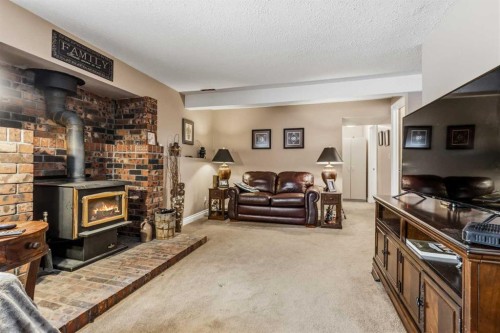 26 Trading Post Trail, Whitecourt, AB - Indoor Photo Showing Living Room With Fireplace