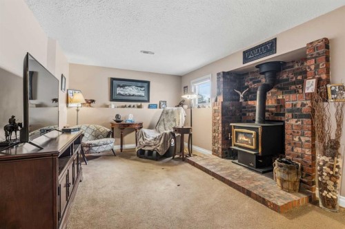 26 Trading Post Trail, Whitecourt, AB - Indoor Photo Showing Other Room With Fireplace