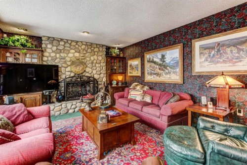 5 Cascade Court, Banff, AB - Indoor Photo Showing Living Room With Fireplace