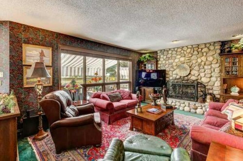 5 Cascade Court, Banff, AB - Indoor Photo Showing Living Room With Fireplace
