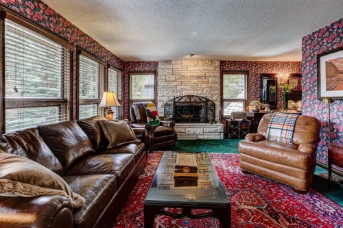5 Cascade Court, Banff, AB - Indoor Photo Showing Living Room With Fireplace