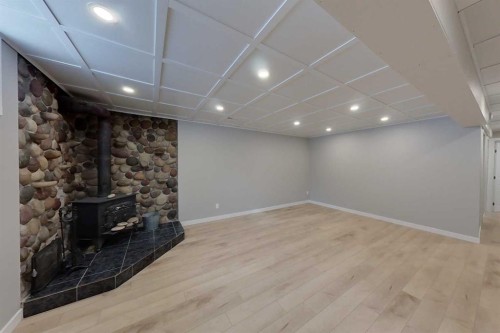 801 3 Avenue Se, Slave Lake, AB - Indoor Photo Showing Other Room With Fireplace