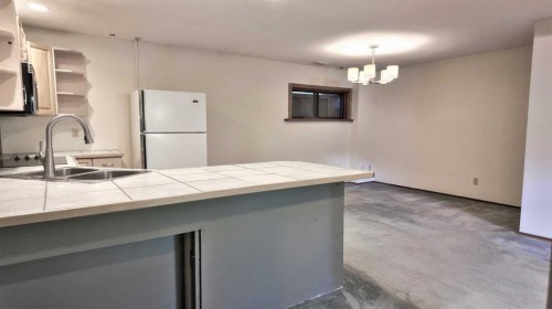 226 Lady Macdonald Drive, Canmore, AB - Indoor Photo Showing Kitchen With Double Sink