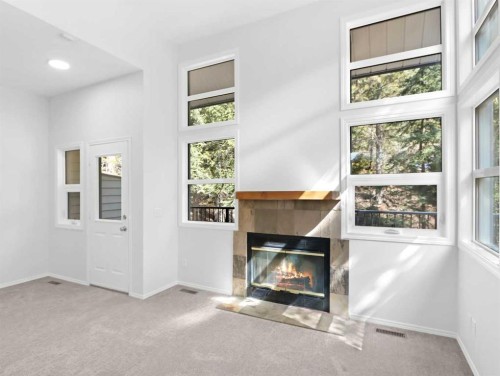 29-242 Benchlands Terrace, Canmore, AB - Indoor With Fireplace