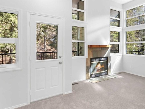 29-242 Benchlands Terrace, Canmore, AB - Indoor With Fireplace
