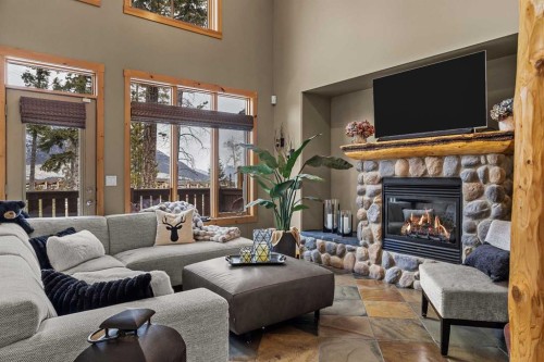 150 Hubman Landing, Canmore, AB - Indoor Photo Showing Living Room With Fireplace