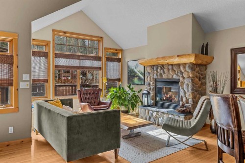 150 Hubman Landing, Canmore, AB - Indoor Photo Showing Living Room With Fireplace