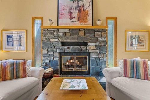 204 Grassi Place, Canmore, AB - Indoor Photo Showing Living Room With Fireplace