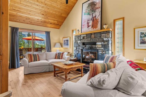 204 Grassi Place, Canmore, AB - Indoor Photo Showing Living Room With Fireplace