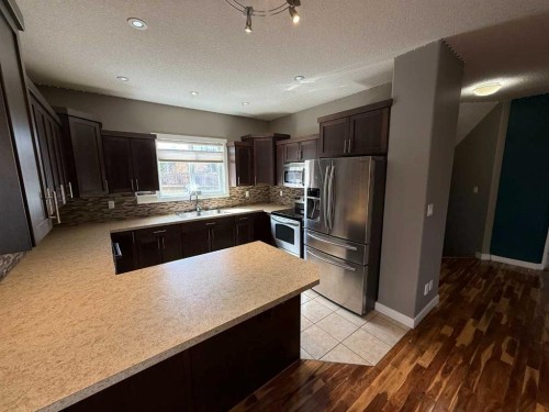 107 Wolf Willow Cove, Hinton, AB - Indoor Photo Showing Kitchen With Double Sink