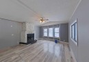 2135 Mistassiniy Road, Wabasca, AB  - Indoor Photo Showing Other Room With Fireplace 