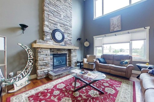 10 Parkdale Way Se, Slave Lake, AB - Indoor Photo Showing Living Room With Fireplace