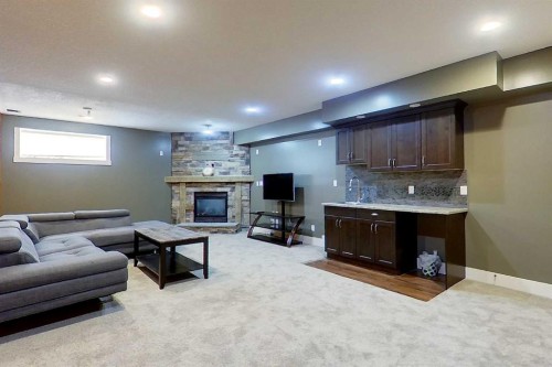 10 Parkdale Way Se, Slave Lake, AB - Indoor Photo Showing Basement With Fireplace