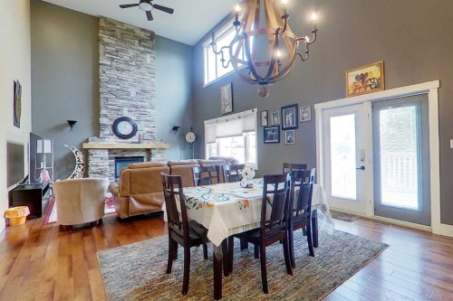 10 Parkdale Way Se, Slave Lake, AB - Indoor Photo Showing Dining Room With Fireplace