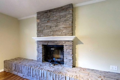 4307 10 Avenue, Edson, AB - Indoor Photo Showing Bedroom With Fireplace