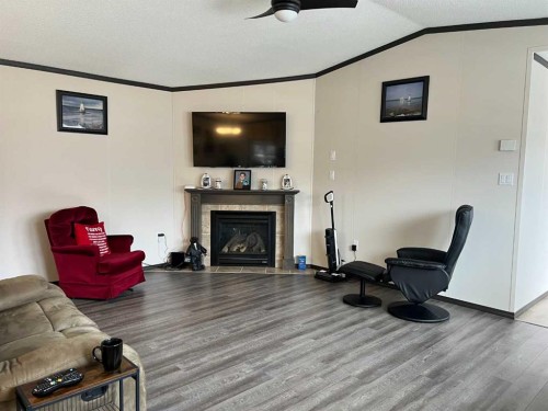 812 5 A Street, Fox Creek, AB - Indoor Photo Showing Living Room With Fireplace