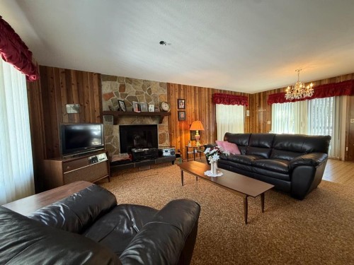 41 Ella Mae Crescent, Whispering Hills, AB - Indoor Photo Showing Living Room With Fireplace
