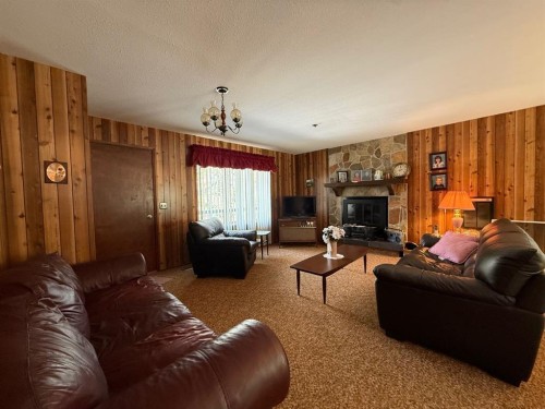 41 Ella Mae Crescent, Whispering Hills, AB - Indoor Photo Showing Living Room With Fireplace