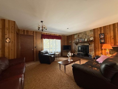41 Ella Mae Crescent, Whispering Hills, AB - Indoor Photo Showing Living Room With Fireplace