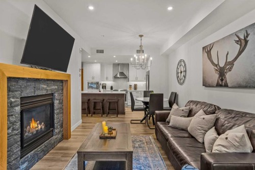 112A-1012 Spring Creek Drive, Canmore, AB - Indoor Photo Showing Living Room With Fireplace