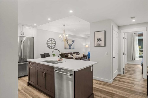 112A-1012 Spring Creek Drive, Canmore, AB - Indoor Photo Showing Kitchen With Stainless Steel Kitchen With Double Sink
