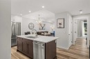 112A-1012 Spring Creek Drive, Canmore, AB  - Indoor Photo Showing Kitchen With Stainless Steel Kitchen With Double Sink 