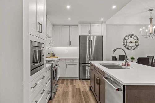 112A-1012 Spring Creek Drive, Canmore, AB - Indoor Photo Showing Kitchen With Stainless Steel Kitchen With Double Sink With Upgraded Kitchen