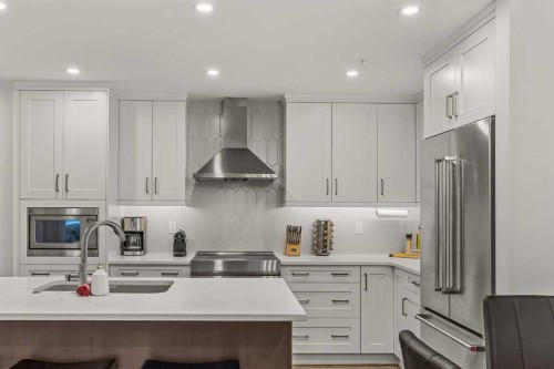 112A-1012 Spring Creek Drive, Canmore, AB - Indoor Photo Showing Kitchen With Stainless Steel Kitchen With Upgraded Kitchen