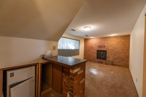 548 Mountain Street, Hinton, AB - Indoor With Fireplace