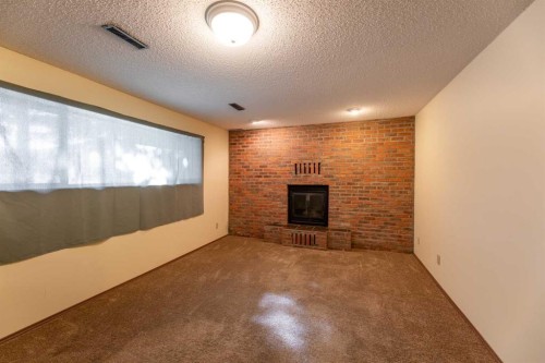 548 Mountain Street, Hinton, AB - Indoor With Fireplace