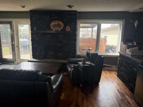 501 7 Avenue, Fox Creek, AB - Indoor Photo Showing Other Room With Fireplace