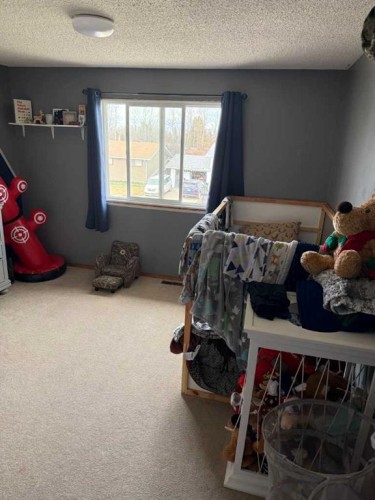 501 7 Avenue, Fox Creek, AB - Indoor Photo Showing Bedroom