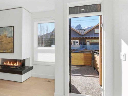 512 8Th Avenue, Canmore, AB - Indoor Photo Showing Other Room With Fireplace