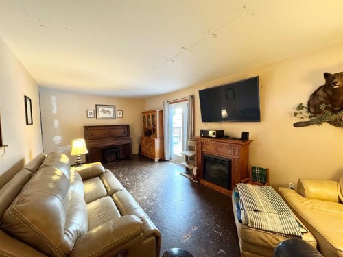 611 4 Avenue, Fox Creek, AB - Indoor Photo Showing Living Room With Fireplace