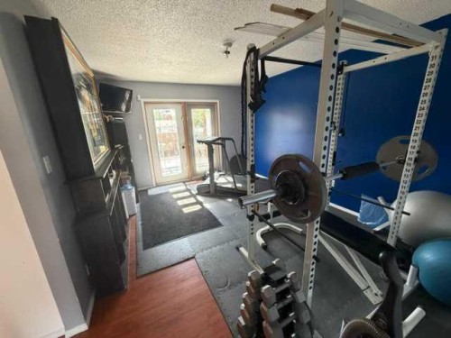 1206 50 Street, Edson, AB - Indoor Photo Showing Gym Room