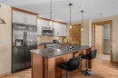 302-2100A Stewart Creek Drive, Canmore, AB  - Indoor Photo Showing Kitchen With Upgraded Kitchen 