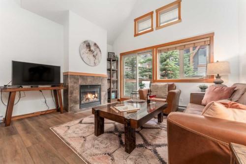 328-101 Montane Road, Canmore, AB - Indoor Photo Showing Living Room With Fireplace
