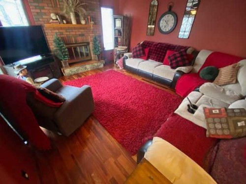 201 Hansen Drive, Hinton, AB - Indoor Photo Showing Living Room With Fireplace