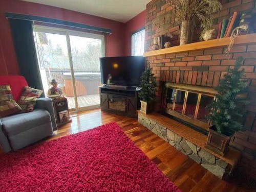 201 Hansen Drive, Hinton, AB - Indoor Photo Showing Living Room With Fireplace