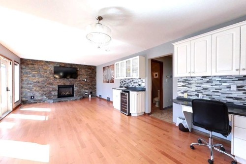 23 Springwood Drive Ne, Slave Lake, AB - Indoor With Fireplace