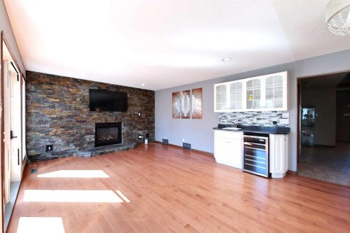 23 Springwood Drive Ne, Slave Lake, AB - Indoor Photo Showing Living Room With Fireplace