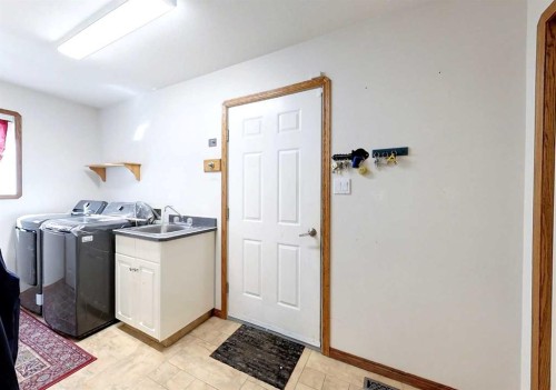 23 Springwood Drive Ne, Slave Lake, AB - Indoor Photo Showing Laundry Room