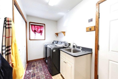 23 Springwood Drive Ne, Slave Lake, AB - Indoor Photo Showing Laundry Room