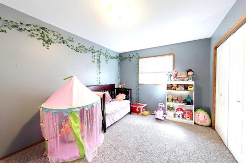 23 Springwood Drive Ne, Slave Lake, AB - Indoor Photo Showing Bedroom