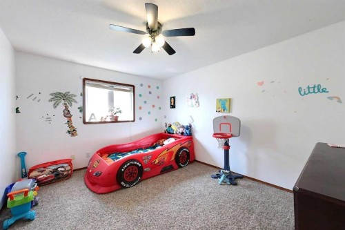 23 Springwood Drive Ne, Slave Lake, AB - Indoor Photo Showing Bedroom