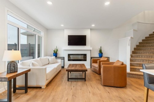 6003 Edmonds Place Nw, Edmonton, AB - Indoor Photo Showing Living Room With Fireplace