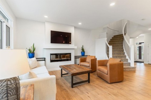 6003 Edmonds Place Nw, Edmonton, AB - Indoor Photo Showing Living Room With Fireplace