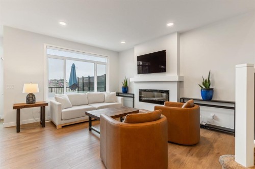 6003 Edmonds Place Nw, Edmonton, AB - Indoor Photo Showing Living Room With Fireplace