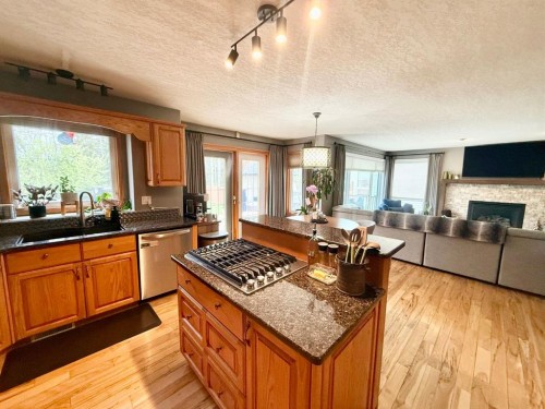 150 Hallam Drive, Hinton, AB - Indoor Photo Showing Kitchen With Fireplace