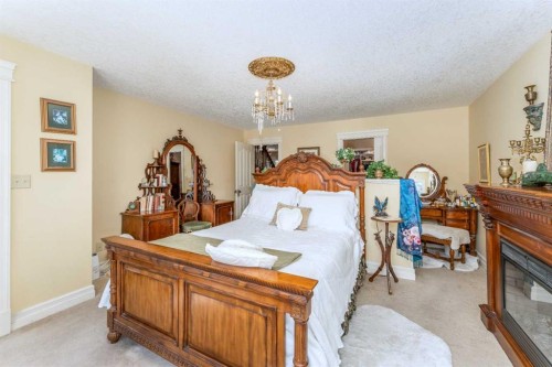 533 1St Street, Canmore, AB - Indoor Photo Showing Bedroom With Fireplace